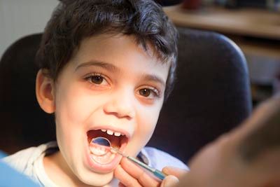 child getting their teeth checked at Bonham Dental Arts