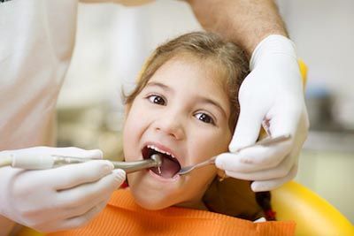 child getting her teeth cleaned at Bonham Dental Arts