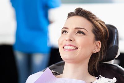 woman smiling during her dental appointment at Bonham Dental Arts