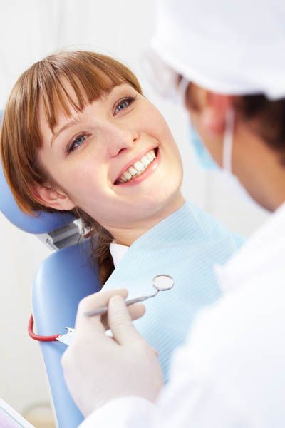 woman getting a dental checkup at Bonham Dental Arts