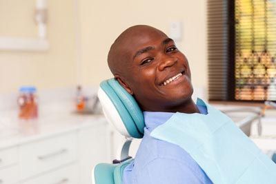 man smiling after a restorative dentistry procedure at Bonham Dental Arts